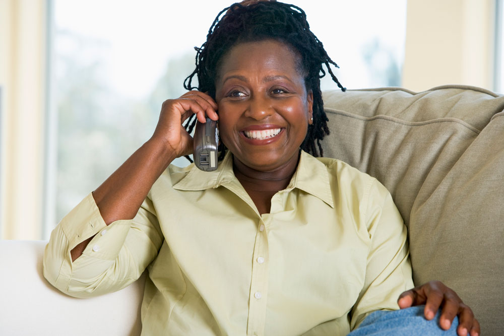 Middle aged woman smiling while on the phone