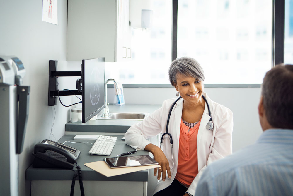 Female dentist having a discussion with a patient